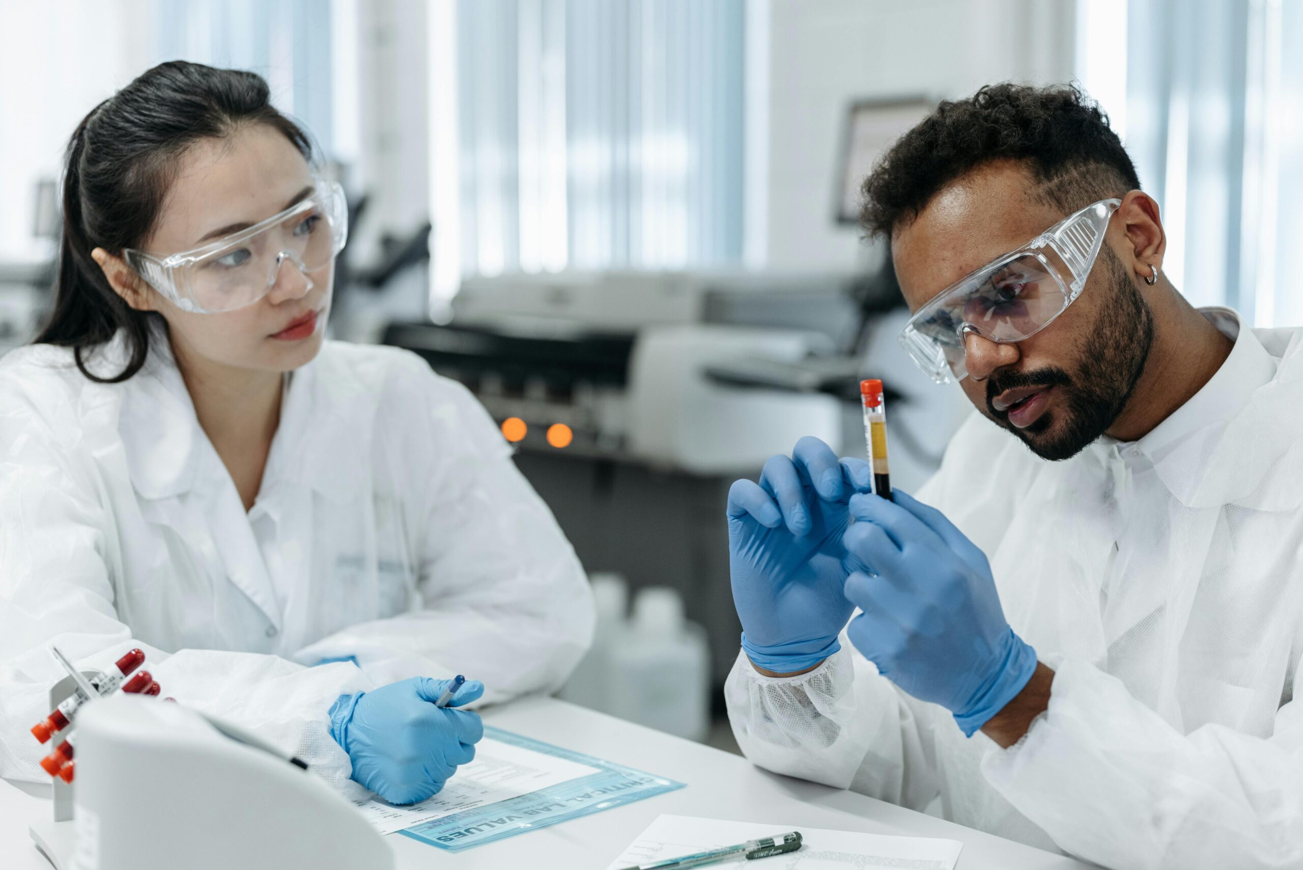 Scientists Collaborating in Modern Biotech Lab